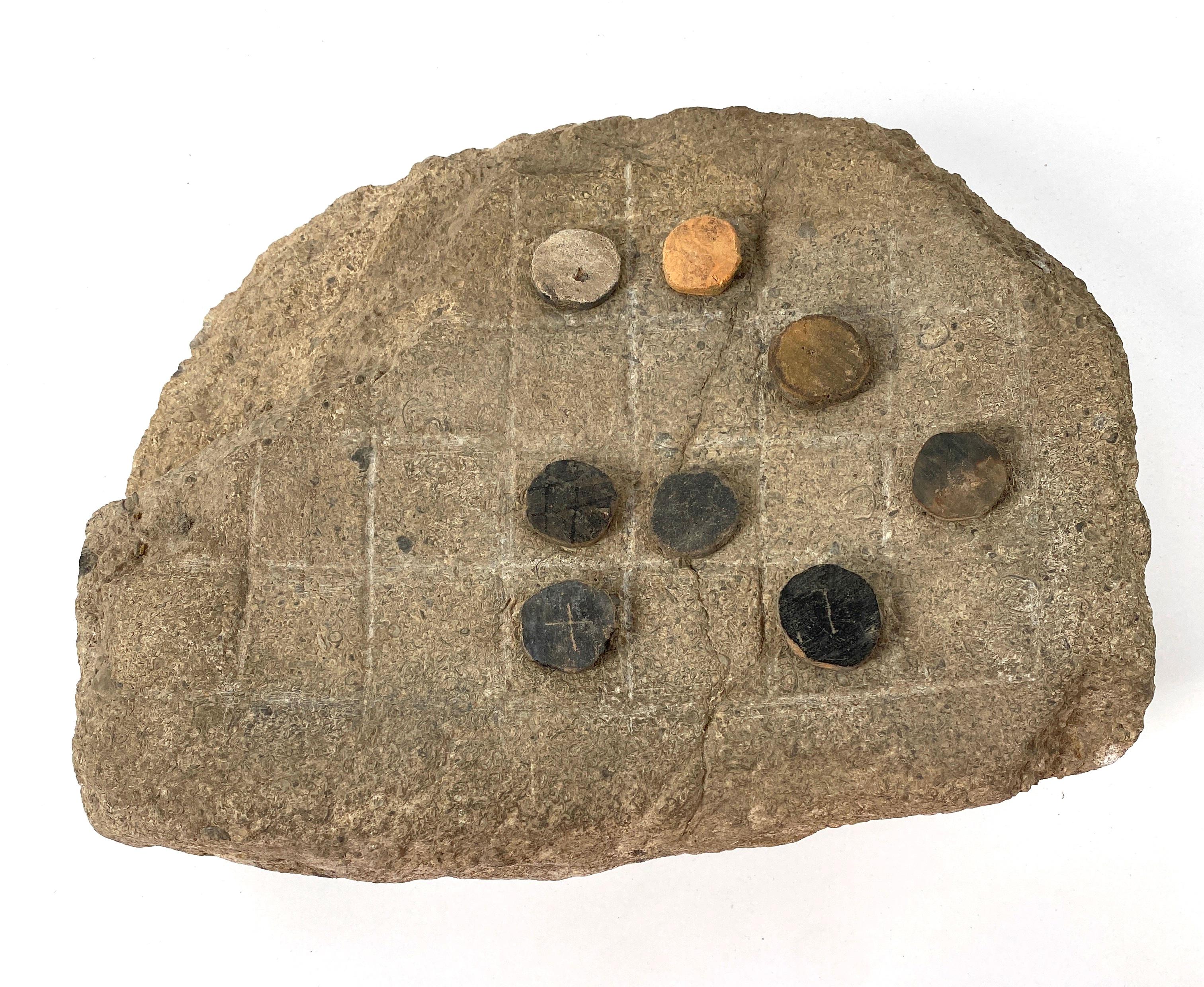 Roman stone gaming board with round counters
